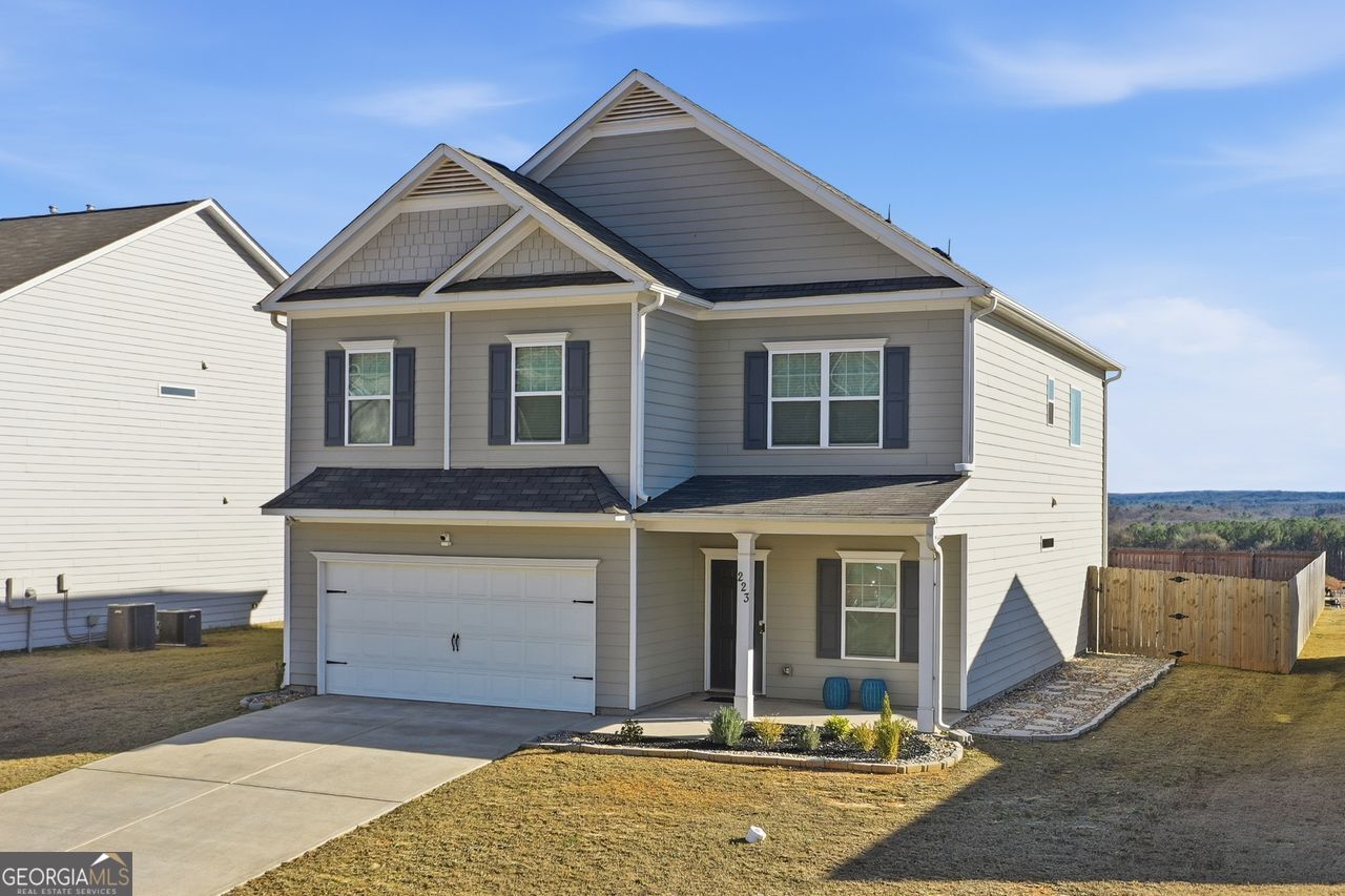 223 Malbone Street Southwest, Unit 5B Cartersville, GA 30120 - Photo 2 of 38 a view of a white house with large windows