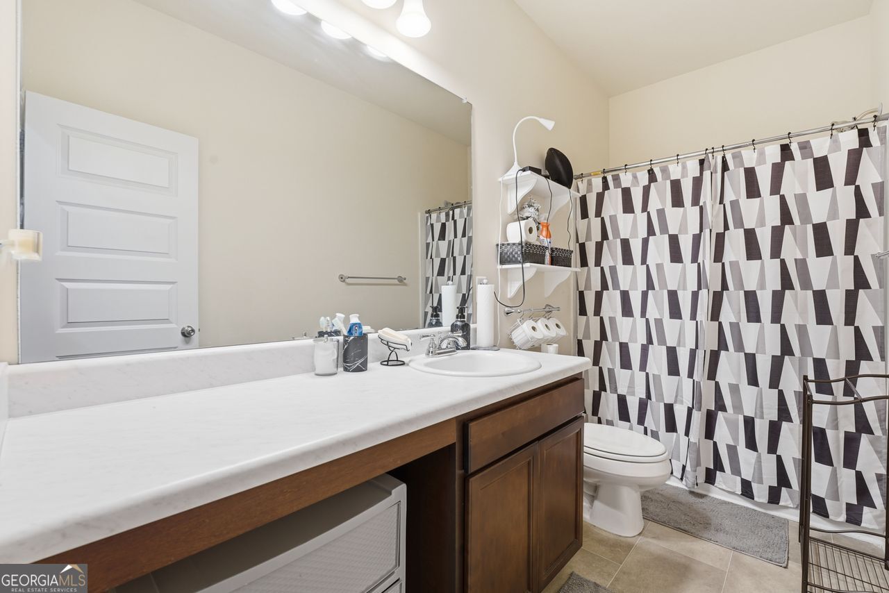 223 Malbone Street Southwest, Unit 5B Cartersville, GA 30120 - Photo 22 of 38 a bathroom with a sink and a mirror