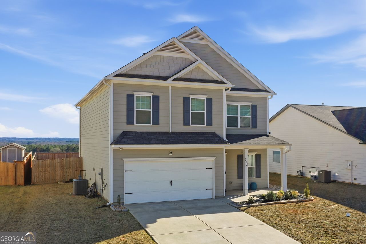 223 Malbone Street Southwest, Unit 5B Cartersville, GA 30120 - Photo 3 of 38 a front view of a house with parking area