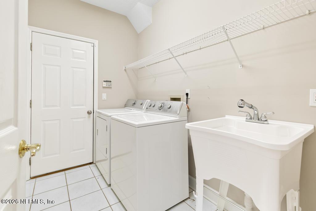 337 South Mill View Way Ponte Vedra Beach, FL 32082 - Photo 44 of 55 a utility room with dryer and washer