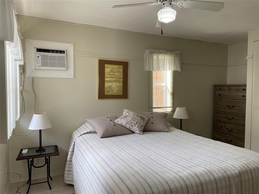 14629 Sunset Drive Delray Beach, FL 33445 - Photo 15 of 35 a bedroom with a bed and a lamp