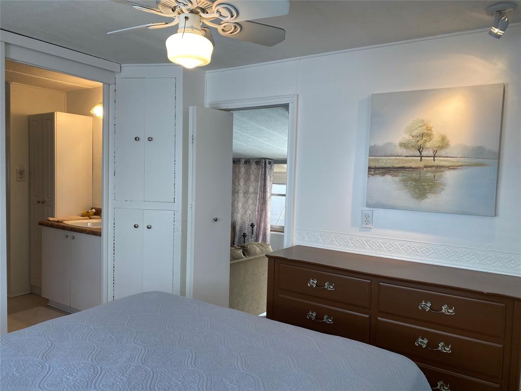 14629 Sunset Drive Delray Beach, FL 33445 - Photo 23 of 35 a bathroom with a sink a light fixture and a mirror