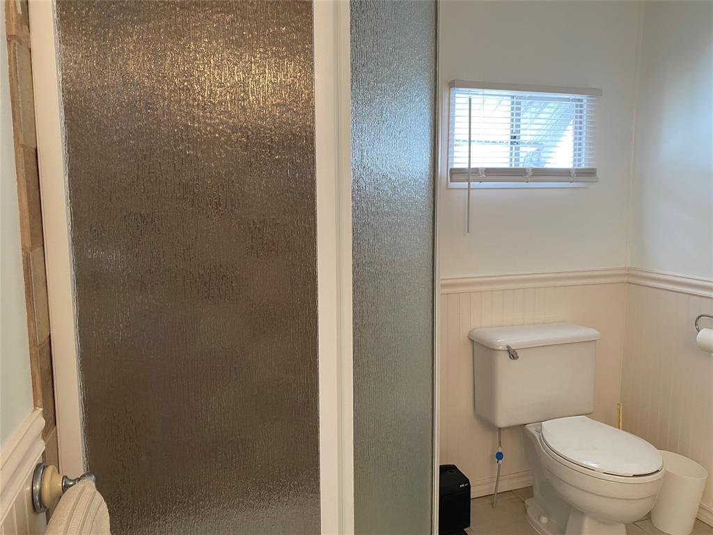 14629 Sunset Drive Delray Beach, FL 33445 - Photo 26 of 35 a white toilet sitting next to a bathroom sink