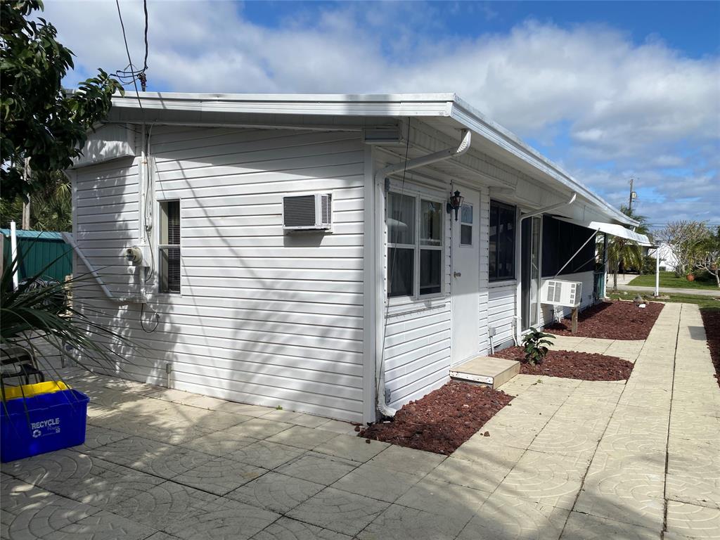 14629 Sunset Drive Delray Beach, FL 33445 - Photo 31 of 35 a view of a house with a yard