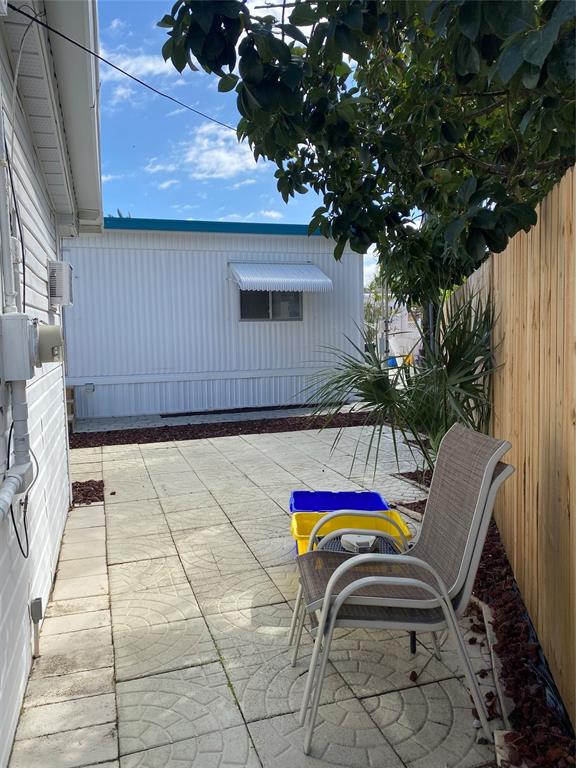 14629 Sunset Drive Delray Beach, FL 33445 - Photo 32 of 35 a view of entryway with outdoor seating