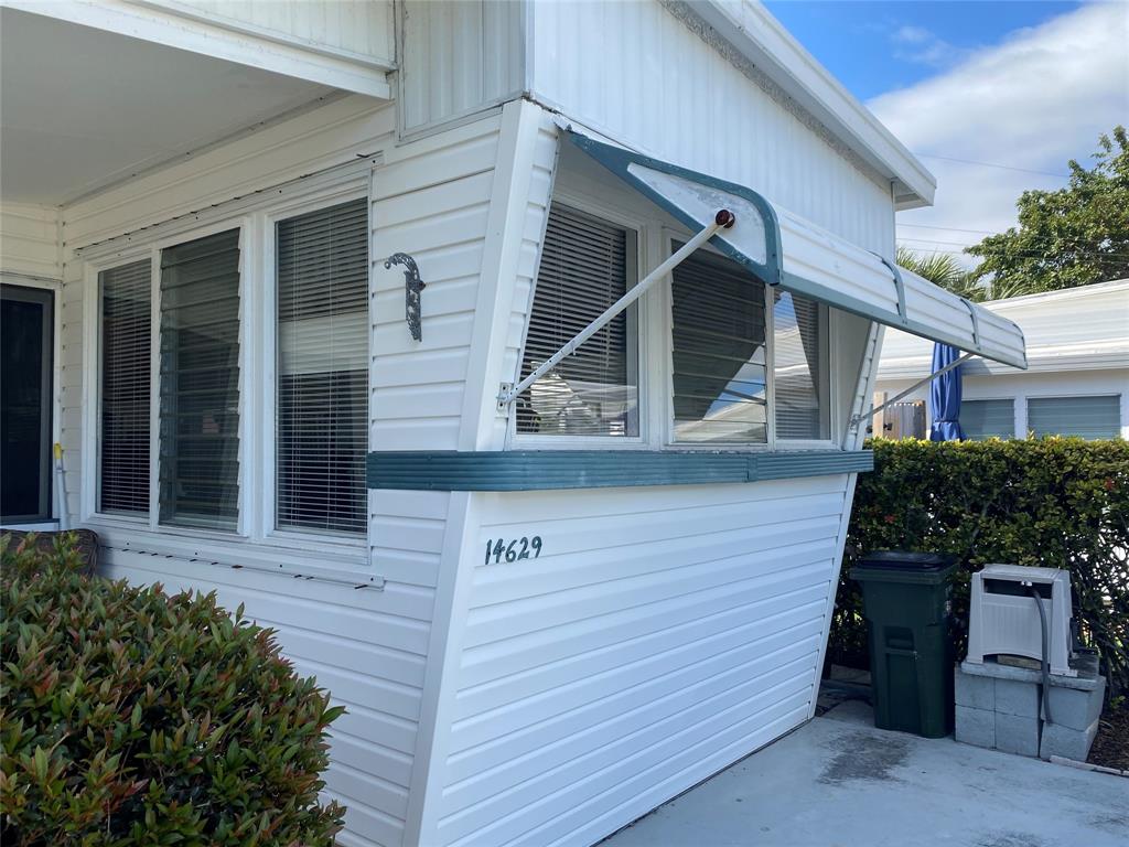 14629 Sunset Drive Delray Beach, FL 33445 - Photo 33 of 35 a view of entrance gate of a house
