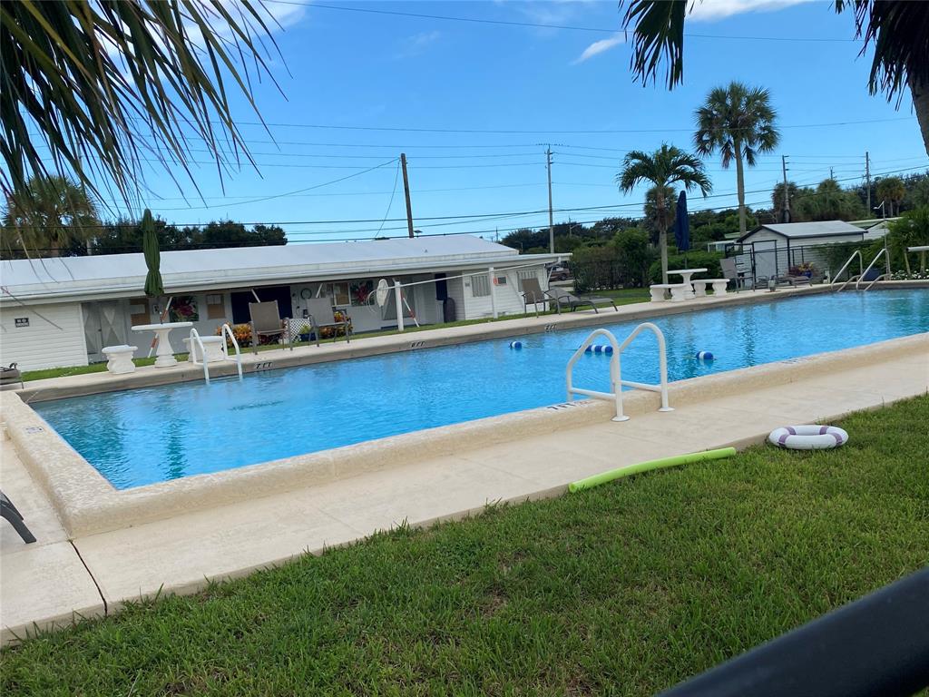 14629 Sunset Drive Delray Beach, FL 33445 - Photo 35 of 35 a view of a house with a swimming pool
