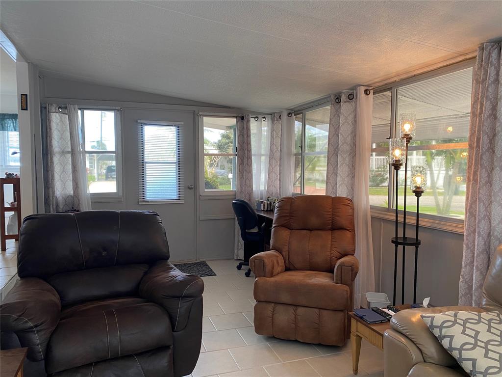 14629 Sunset Drive Delray Beach, FL 33445 - Photo 7 of 35 a living room with furniture and a window