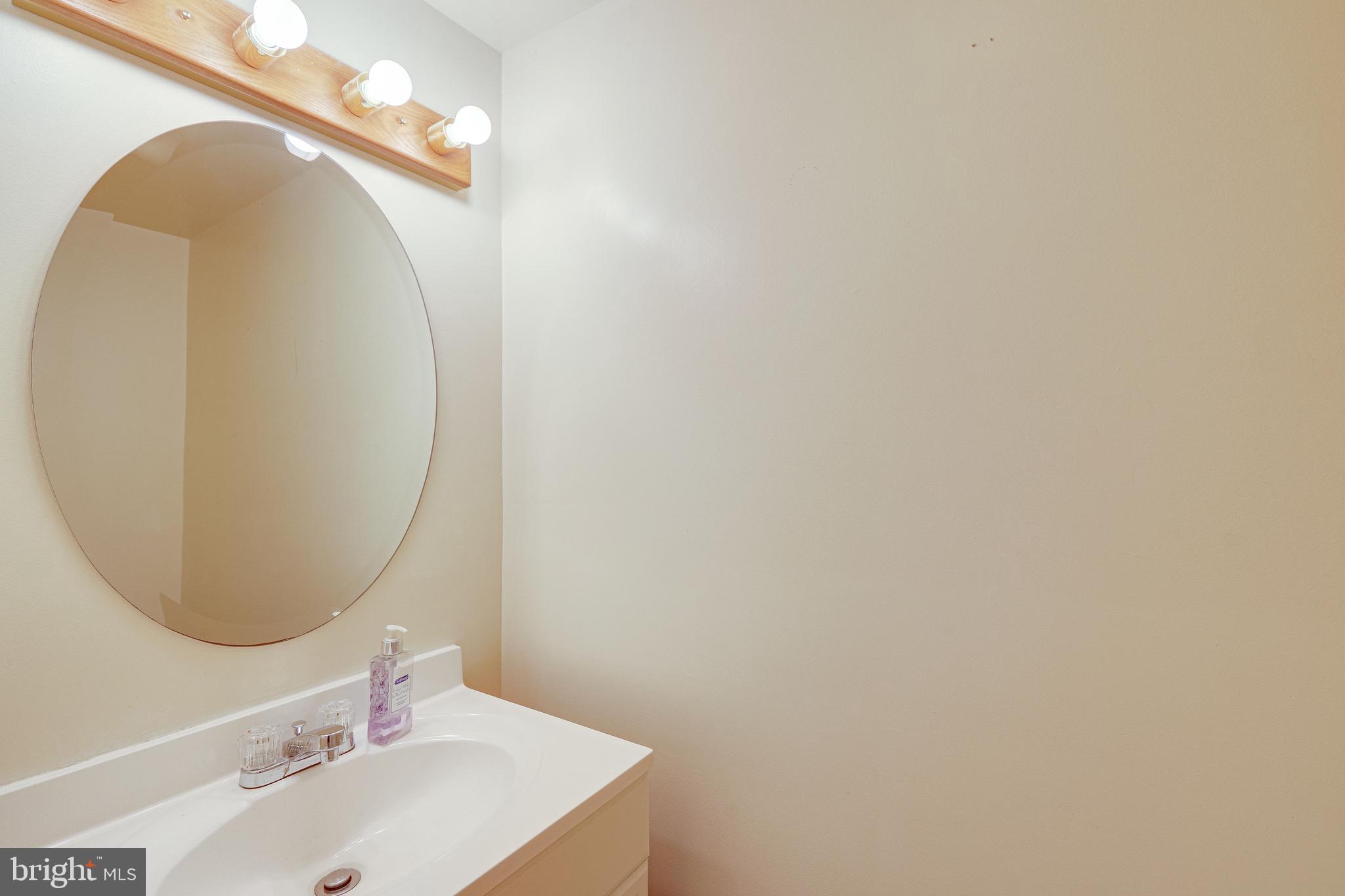 1119 3rd Street Northeast Washington, DC 20002 - Photo 17 of 31 a bathroom with a sink and a mirror