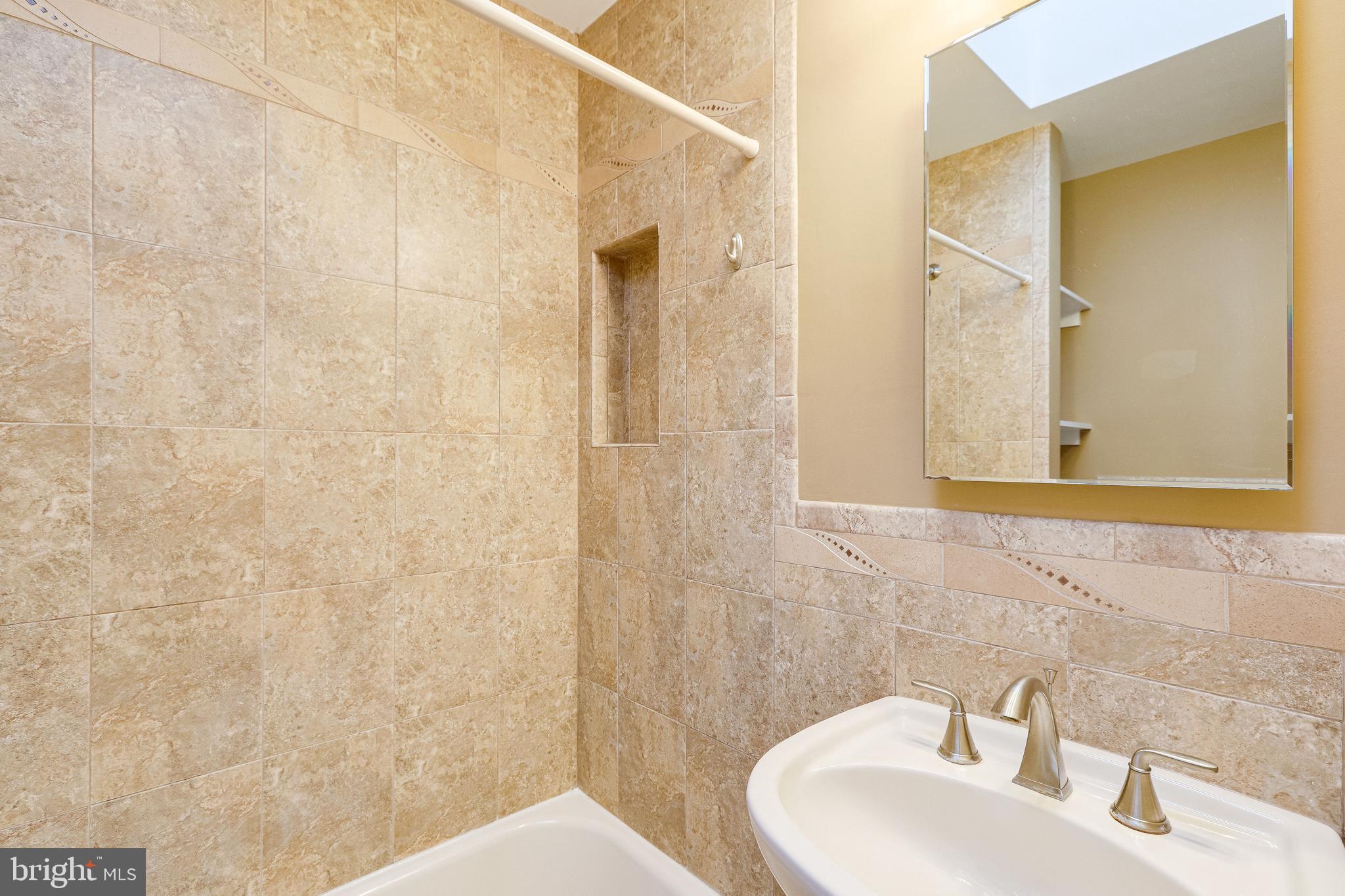 1119 3rd Street Northeast Washington, DC 20002 - Photo 26 of 31 a bathroom with a sink and a mirror