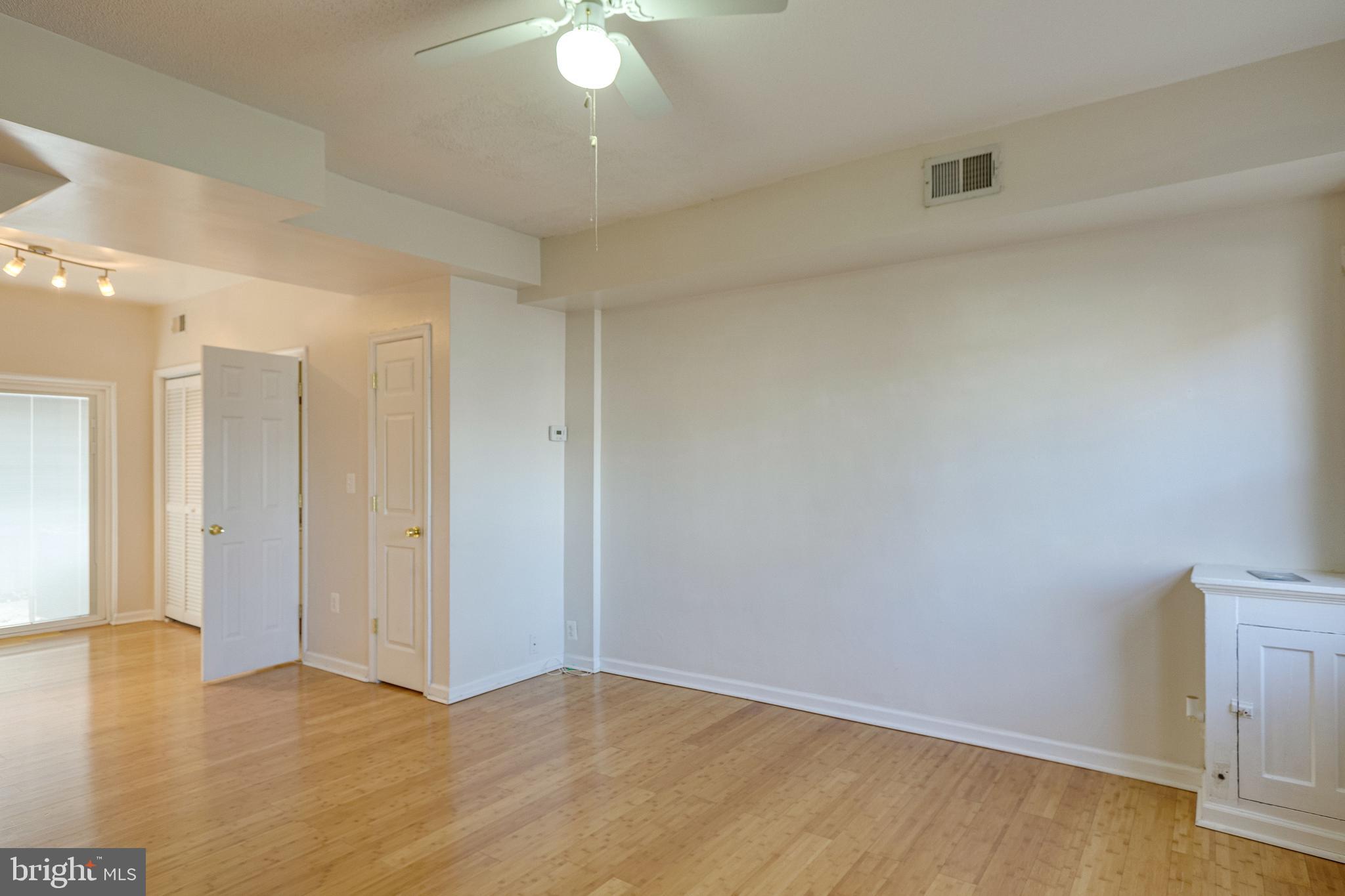 1119 3rd Street Northeast Washington, DC 20002 - Photo 6 of 31 a view of an empty room and wooden floor