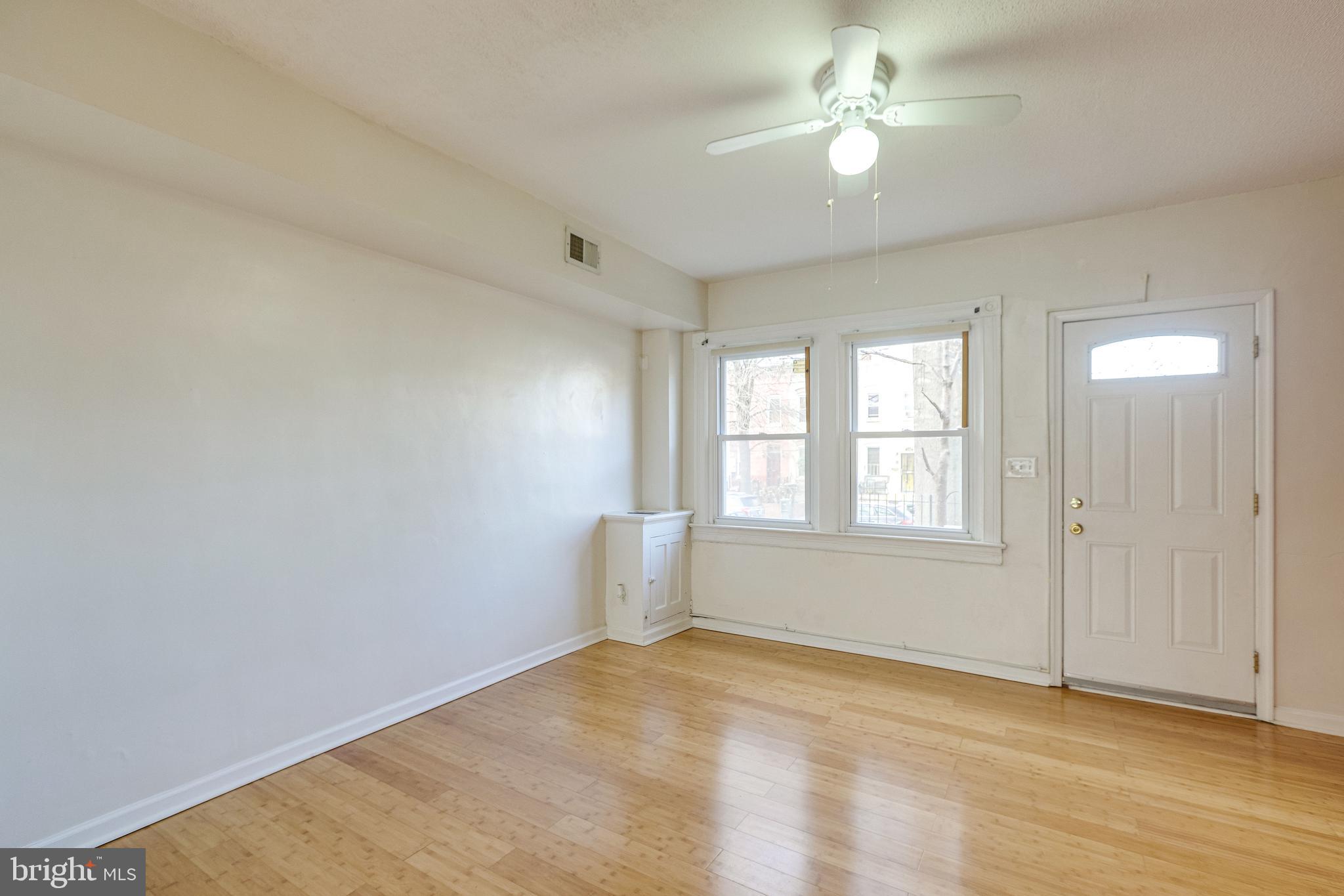 1119 3rd Street Northeast Washington, DC 20002 - Photo 9 of 31 wooden floor in an empty room with a window
