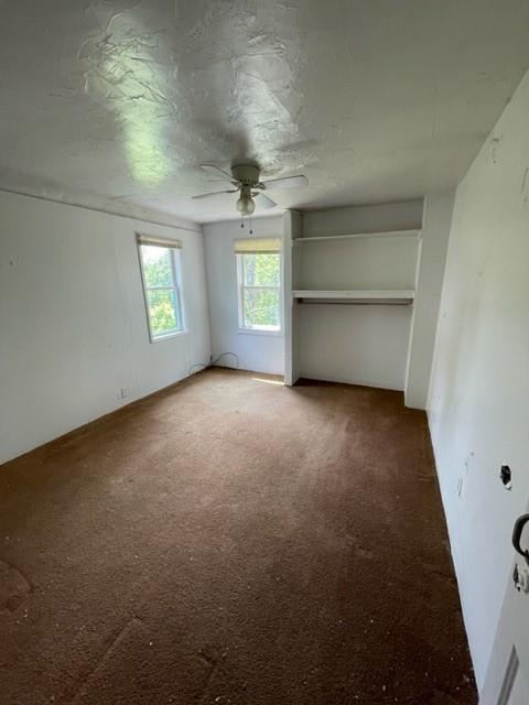 82-84 Roundtop Road Irwin, PA 15642 - Photo 3 of 11 an empty room with a empty space and windows