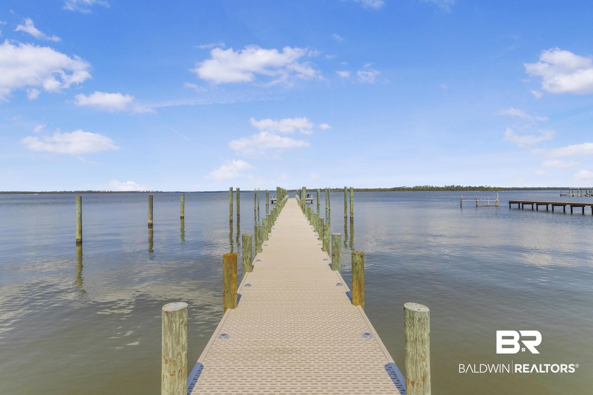 25957 Canal Road, Unit 306 Orange Beach, AL 36561 - Photo 26 of 28 View of dock with a water view
