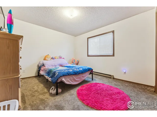 a bedroom with furniture and a bed