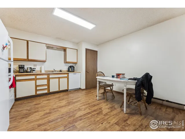 a kitchen with a table and chairs in it