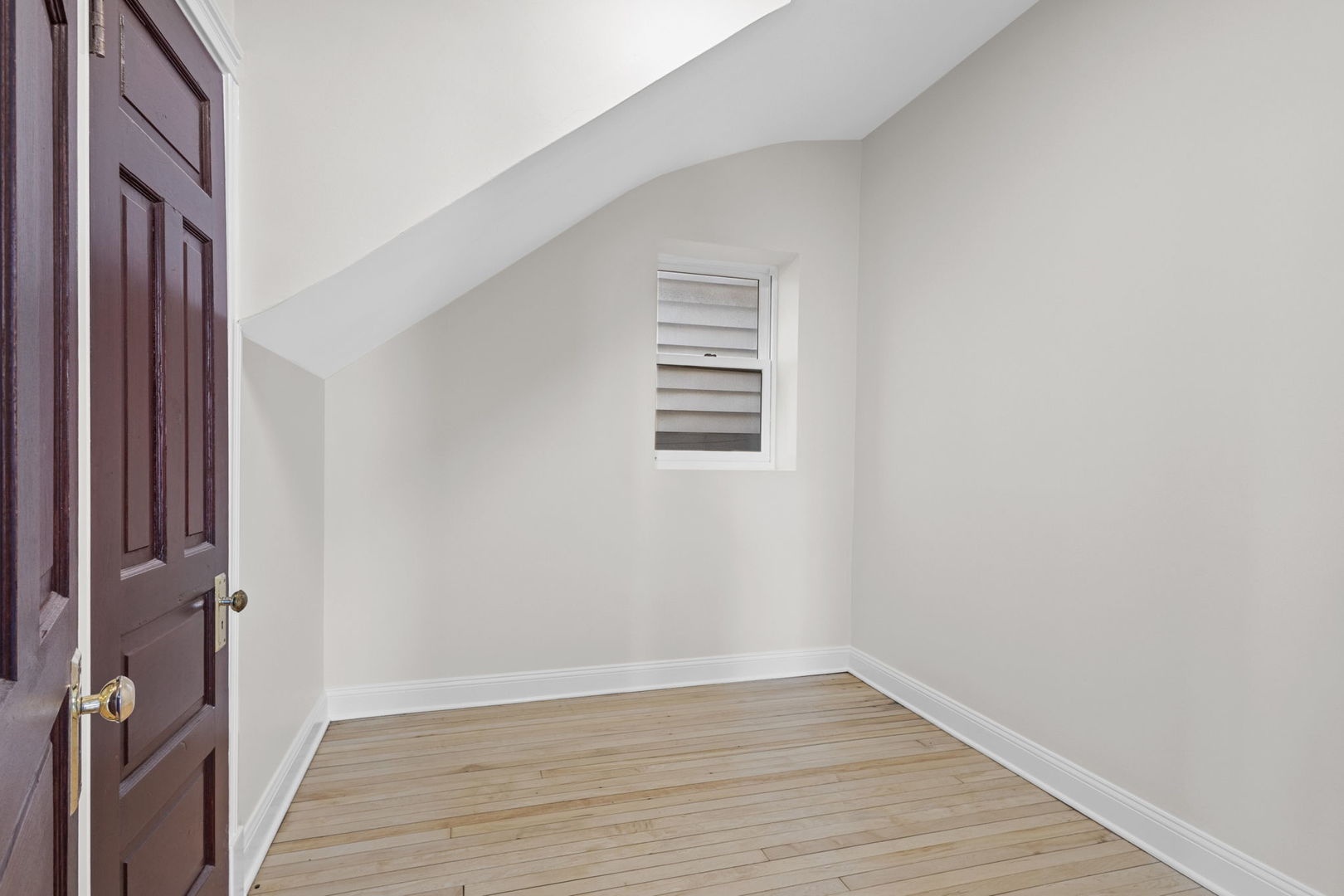 1014 West Roscoe Street, Unit 1F Chicago, IL 60657 - Photo 6 of 15 a view of a room that has wooden floor and entryway