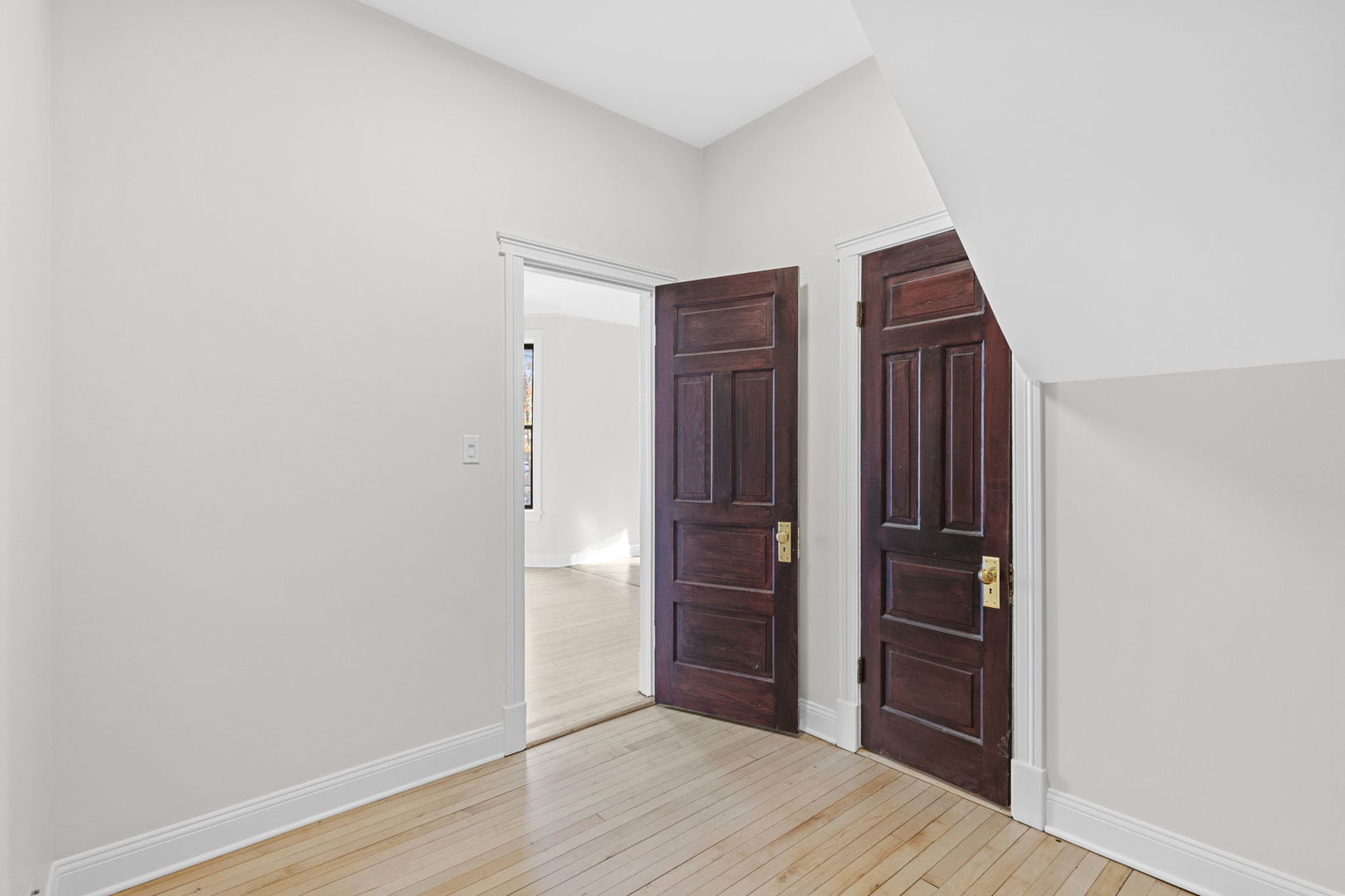 1014 West Roscoe Street, Unit 1F Chicago, IL 60657 - Photo 7 of 15 wooden floor and closet in a room