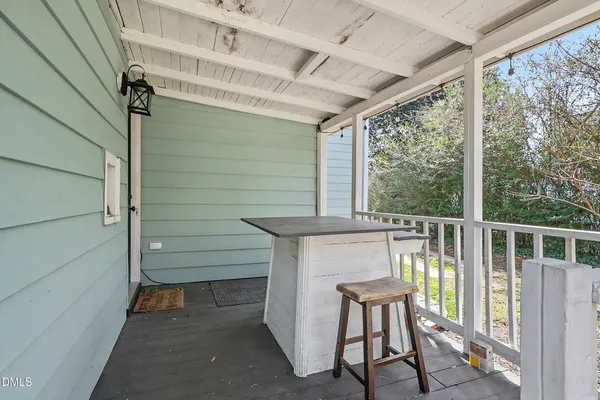 a view of two chairs in the balcony