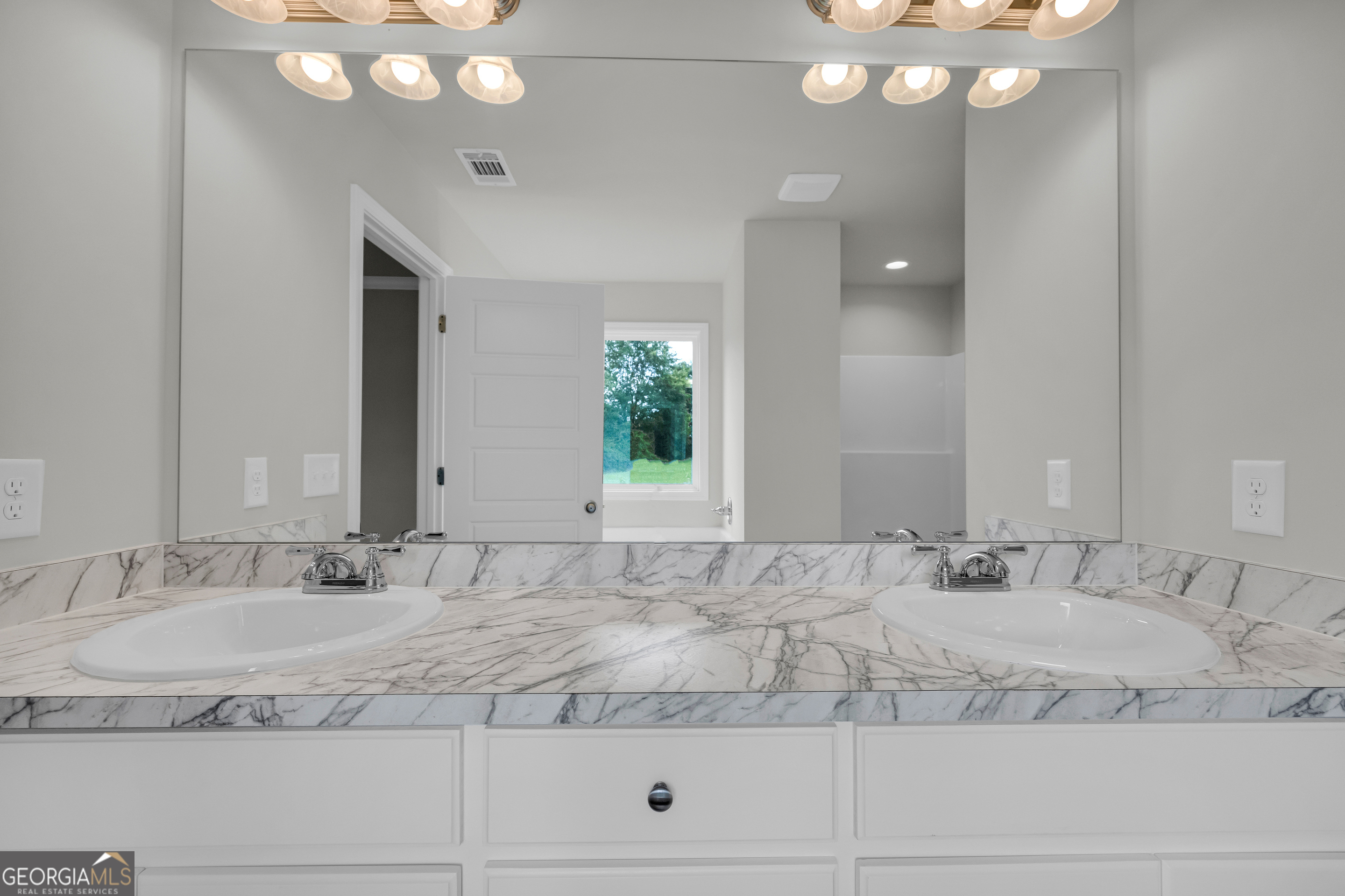 110 Sewell Road Lavonia, GA 30553 - Photo 18 of 73 a bathroom with a granite countertop sink and a mirror