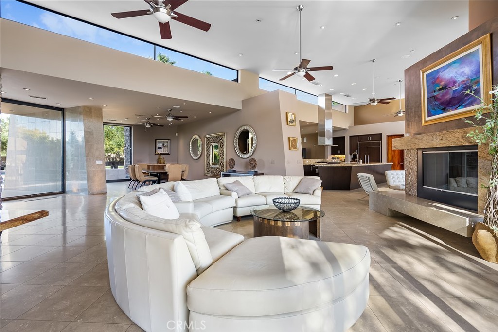 68 Royal St Georges Way Rancho Mirage, CA 92270 - Photo 40 of 75 a living room with fireplace furniture and a chandelier