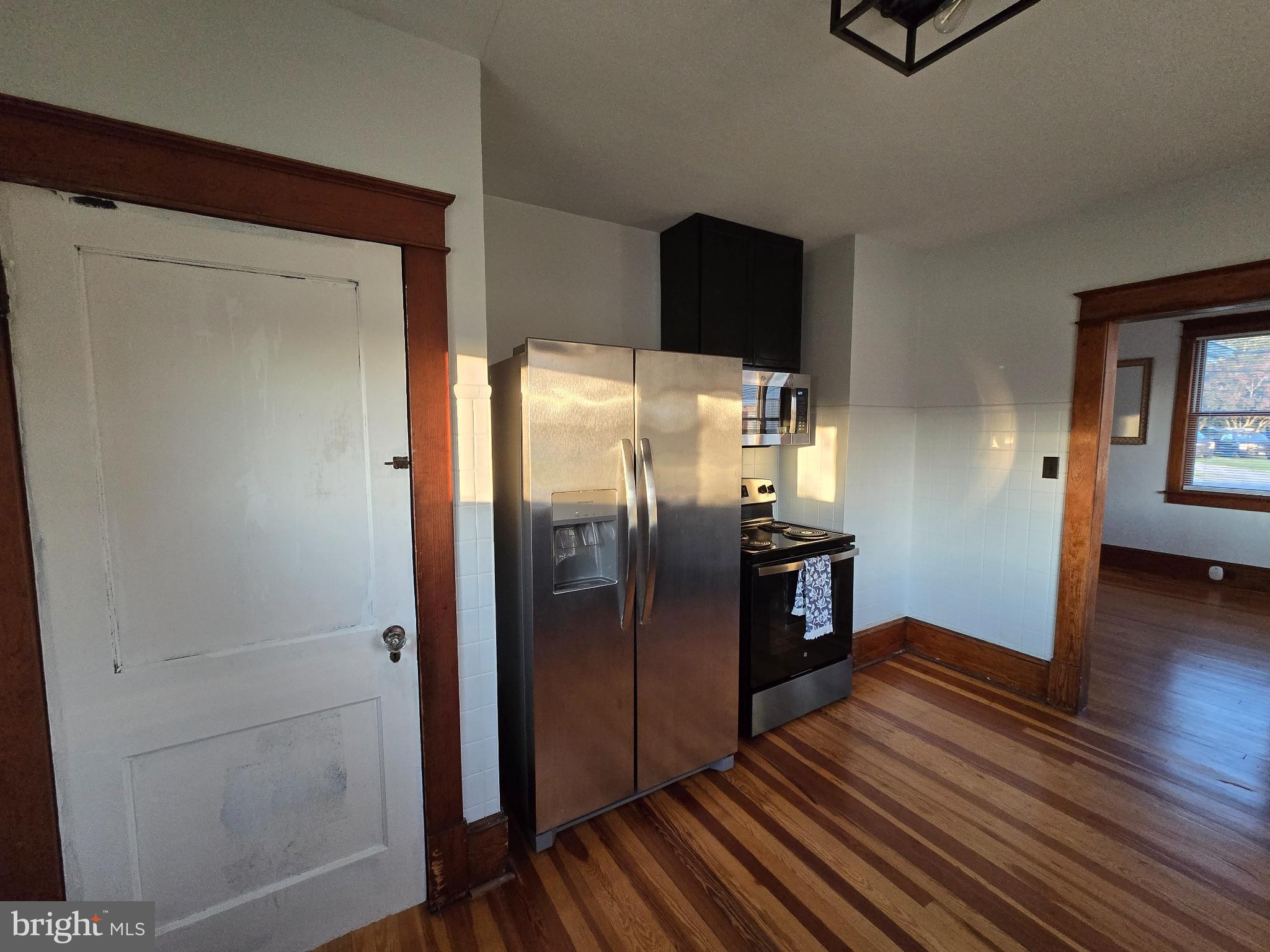 14198 Union Street Milton, DE 19968 - Photo 24 of 49 Modern kitchen with warm wooden accents.