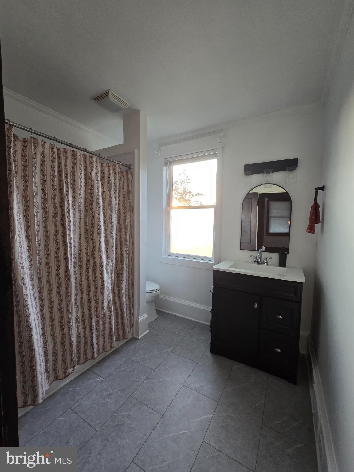14198 Union Street Milton, DE 19968 - Photo 29 of 49 Bright and airy bathroom with modern touches.