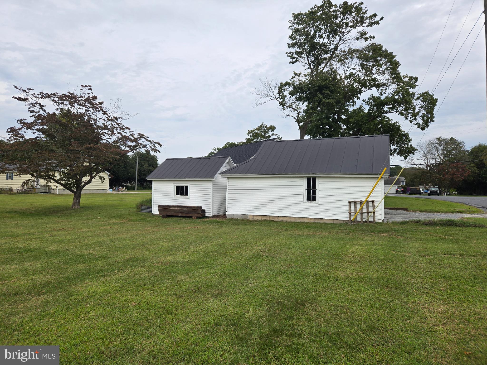 14198 Union Street Milton, DE 19968 - Photo 35 of 49 Charming white cottage on lush green lawn.