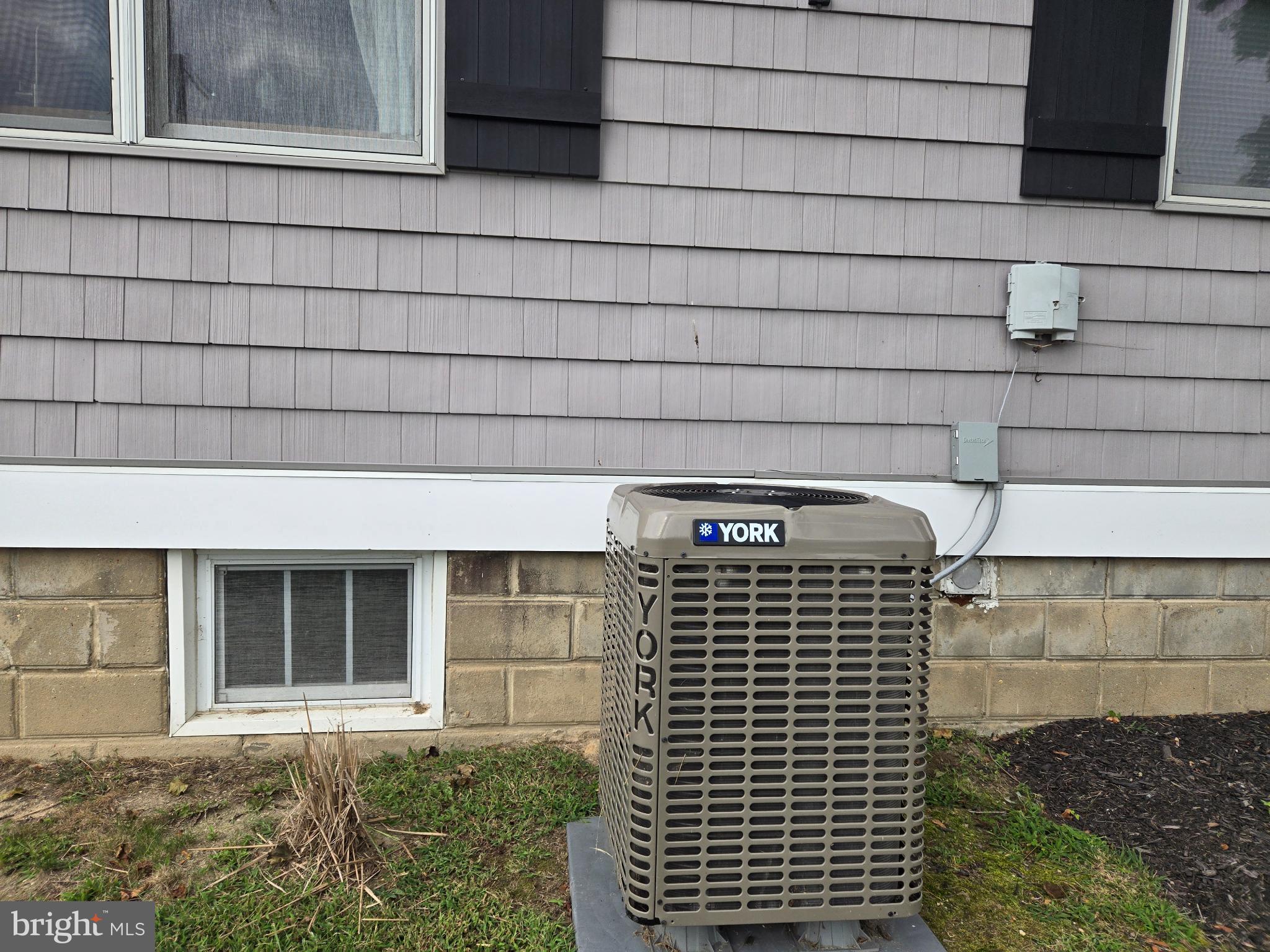 14198 Union Street Milton, DE 19968 - Photo 39 of 49 Efficient cooling unit by a charming home.