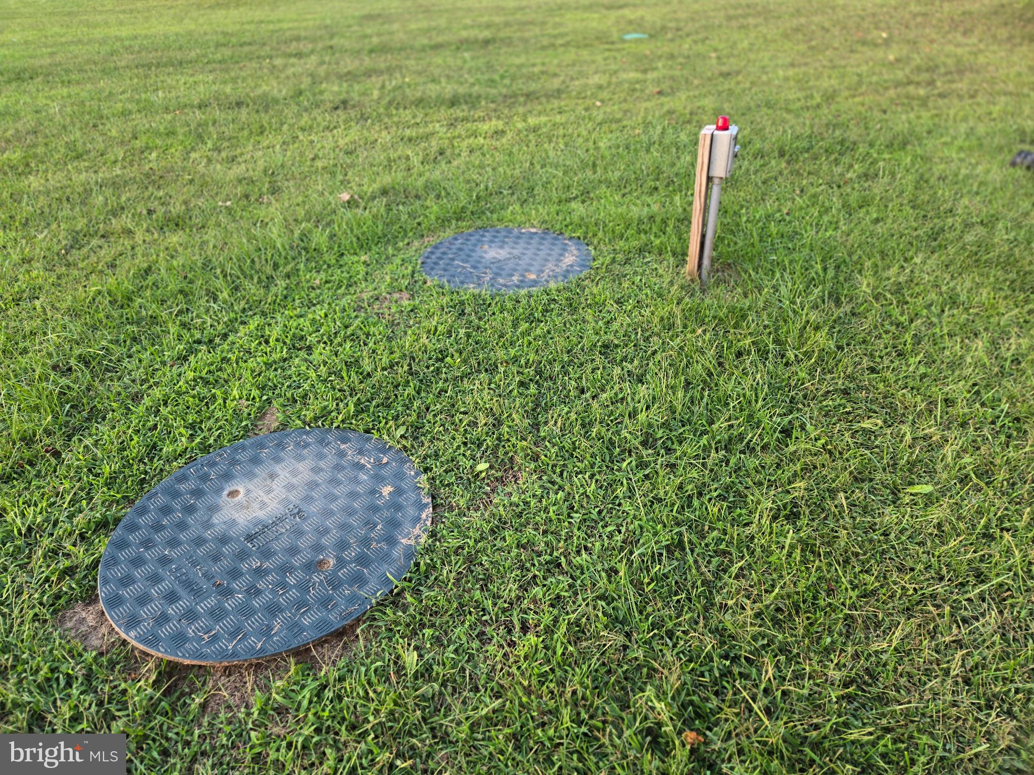 14198 Union Street Milton, DE 19968 - Photo 42 of 49 Utility access points in a lush green field.