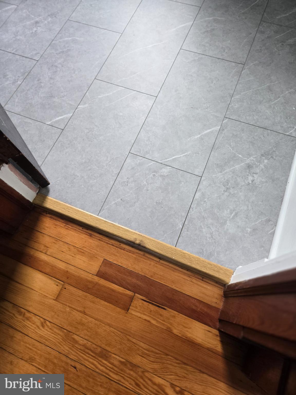 14198 Union Street Milton, DE 19968 - Photo 47 of 49 Seamless blend of wood and tile flooring.