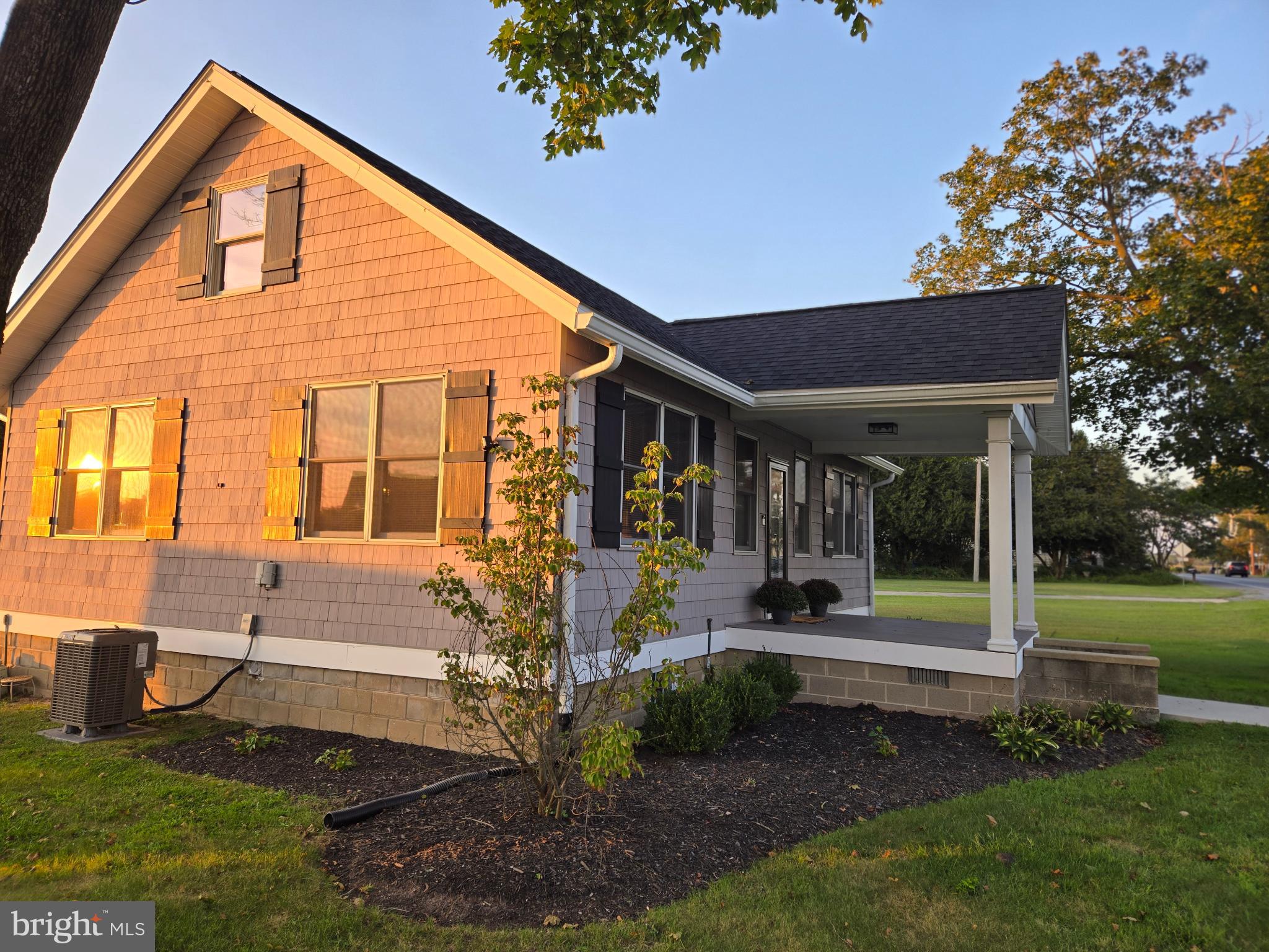 14198 Union Street Milton, DE 19968 - Photo 5 of 49 Charming home basking in golden sunset glow.