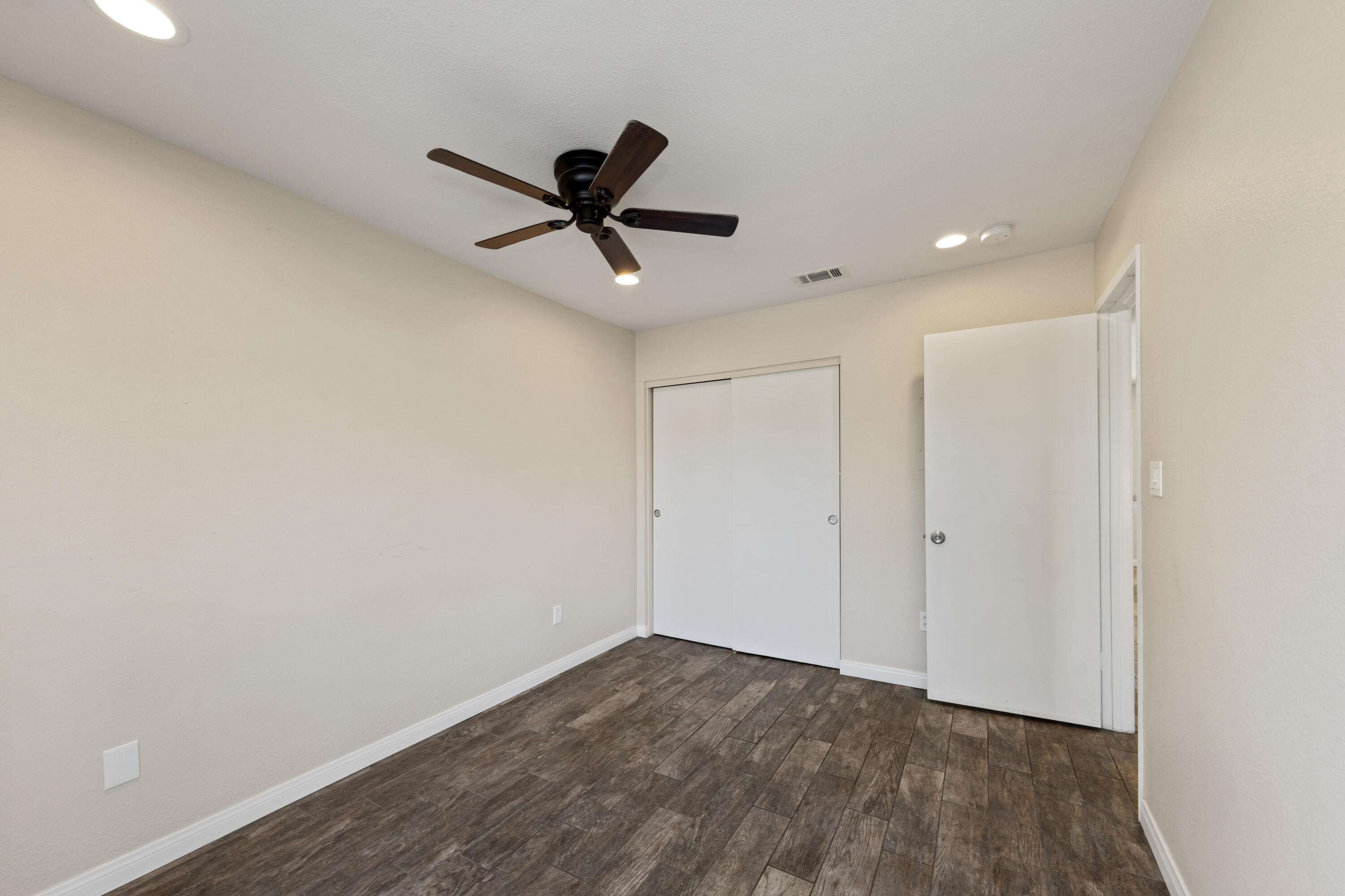 82567 Ave 48, Unit 103 Indio, CA 92201 - Photo 11 of 26 a view of empty room with wooden floor