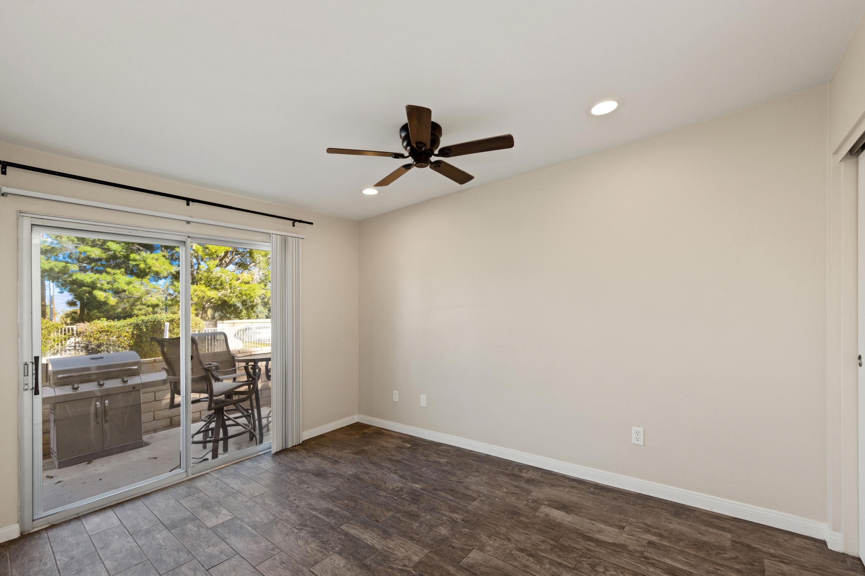 82567 Ave 48, Unit 103 Indio, CA 92201 - Photo 12 of 26 wooden floor in an empty room with a window