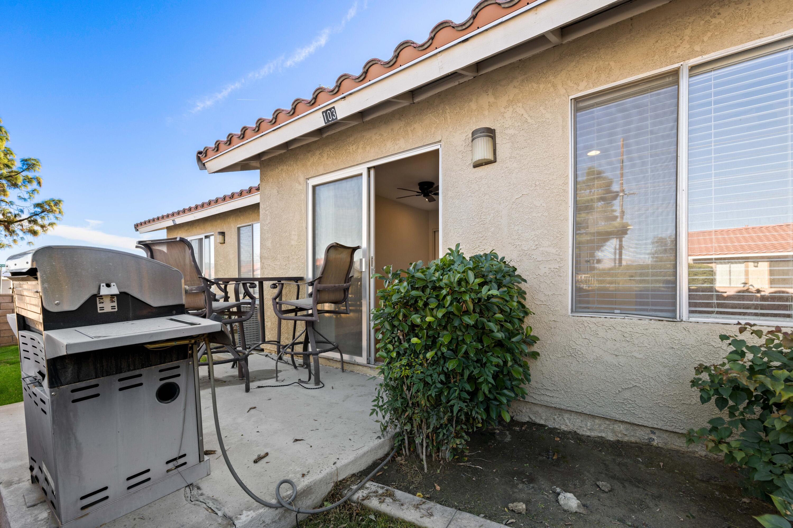 82567 Ave 48, Unit 103 Indio, CA 92201 - Photo 14 of 26 a view of house with patio outdoor seating space