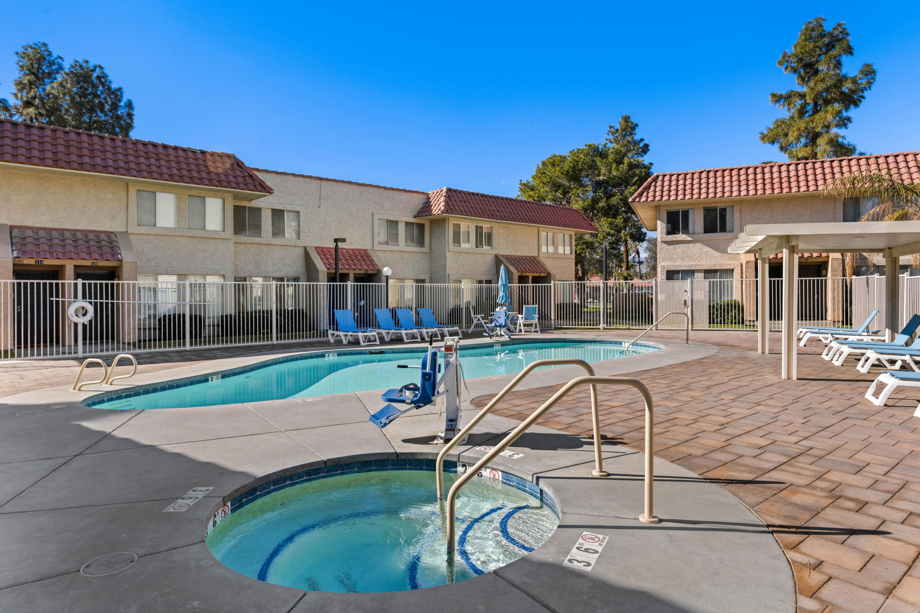 82567 Ave 48, Unit 103 Indio, CA 92201 - Photo 16 of 26 a view of a house with backyard porch and patio