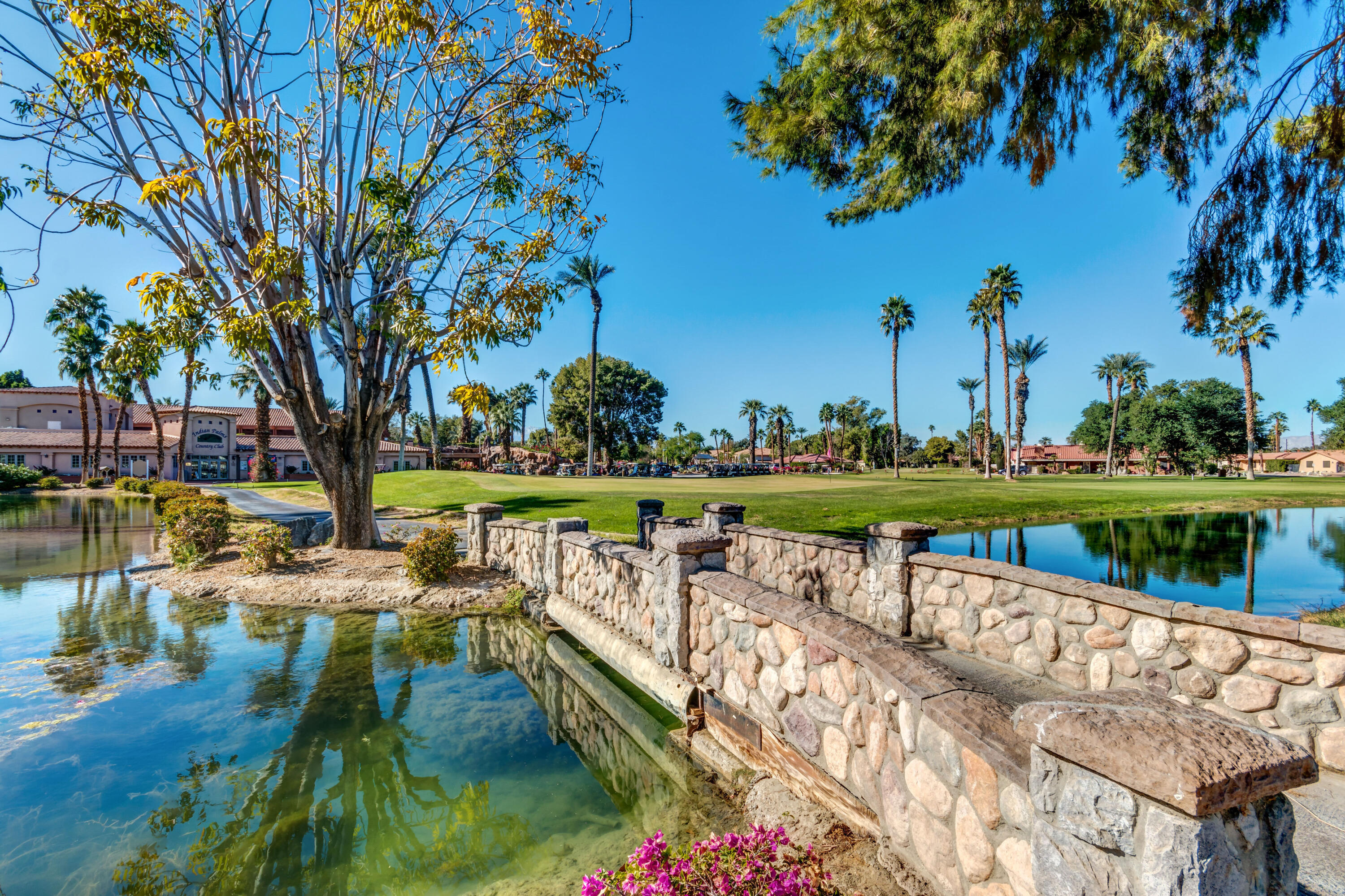 82567 Ave 48, Unit 103 Indio, CA 92201 - Photo 26 of 26 a view of swimming pool with outdoor seating and lake