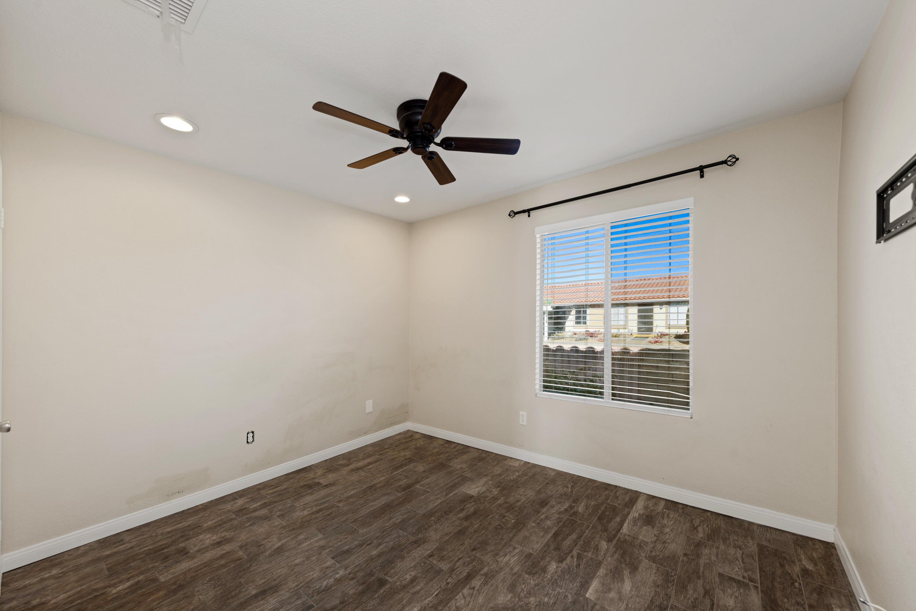 82567 Ave 48, Unit 103 Indio, CA 92201 - Photo 10 of 26 a view of empty room with wooden floor and fan
