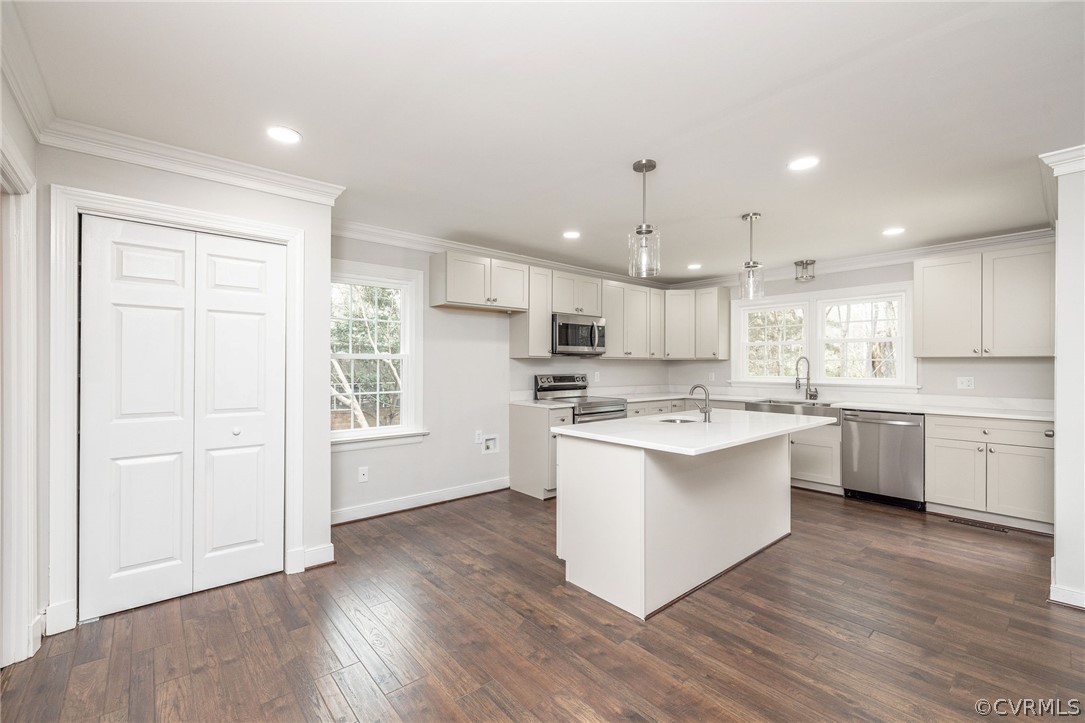 11633 Boyd Road Chester, VA 23831 - Photo 15 of 49 a large kitchen with a center island wooden floor and a window