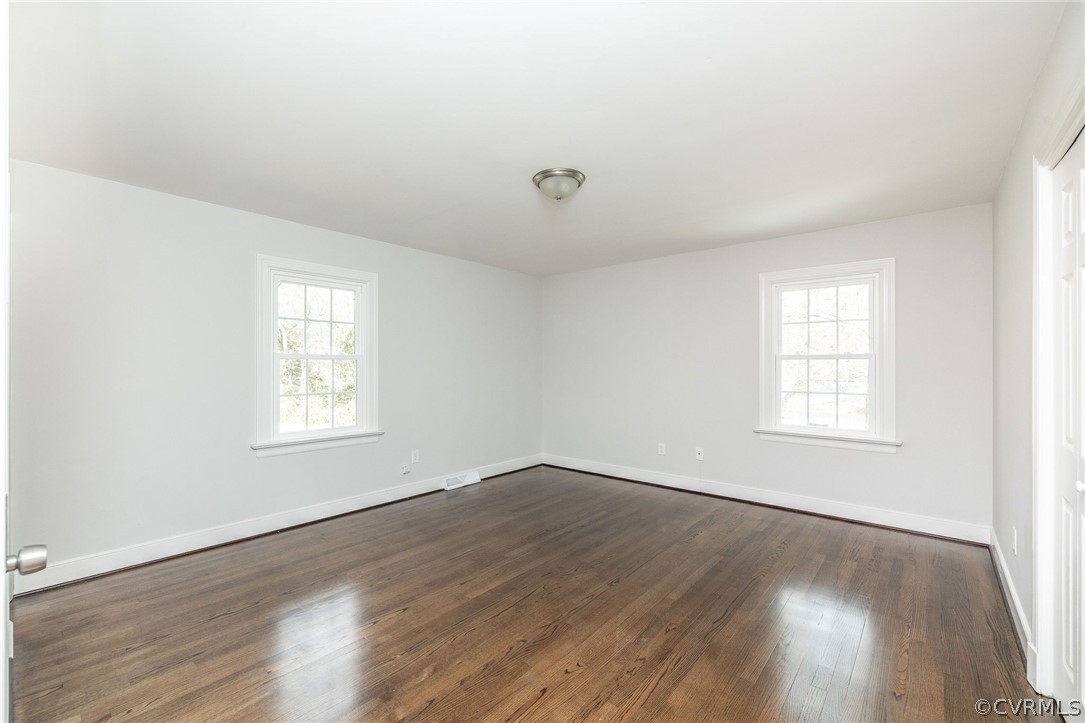 11633 Boyd Road Chester, VA 23831 - Photo 28 of 49 an empty room with wooden floor and windows