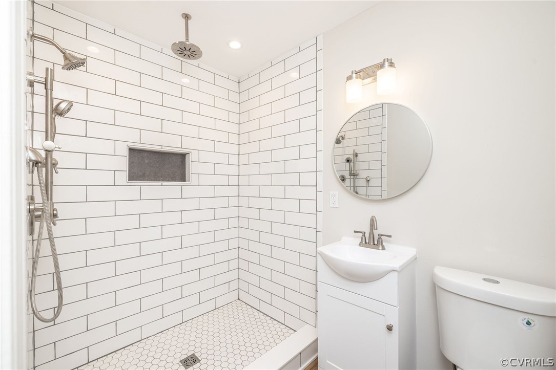 11633 Boyd Road Chester, VA 23831 - Photo 29 of 49 a bathroom with a sink a toilet and shower