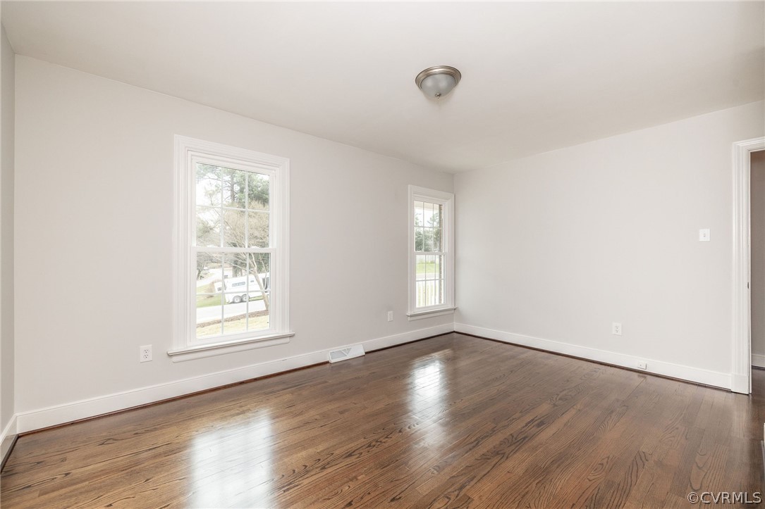 11633 Boyd Road Chester, VA 23831 - Photo 32 of 49 an empty room with wooden floor and windows