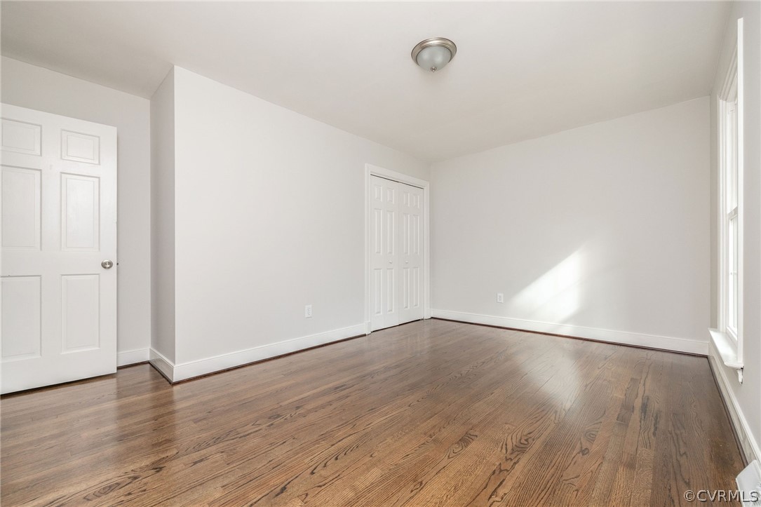 11633 Boyd Road Chester, VA 23831 - Photo 33 of 49 an empty room with wooden floor and windows
