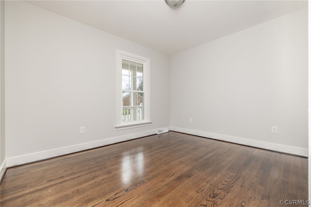 11633 Boyd Road Chester, VA 23831 - Photo 34 of 49 an empty room with wooden floor and windows