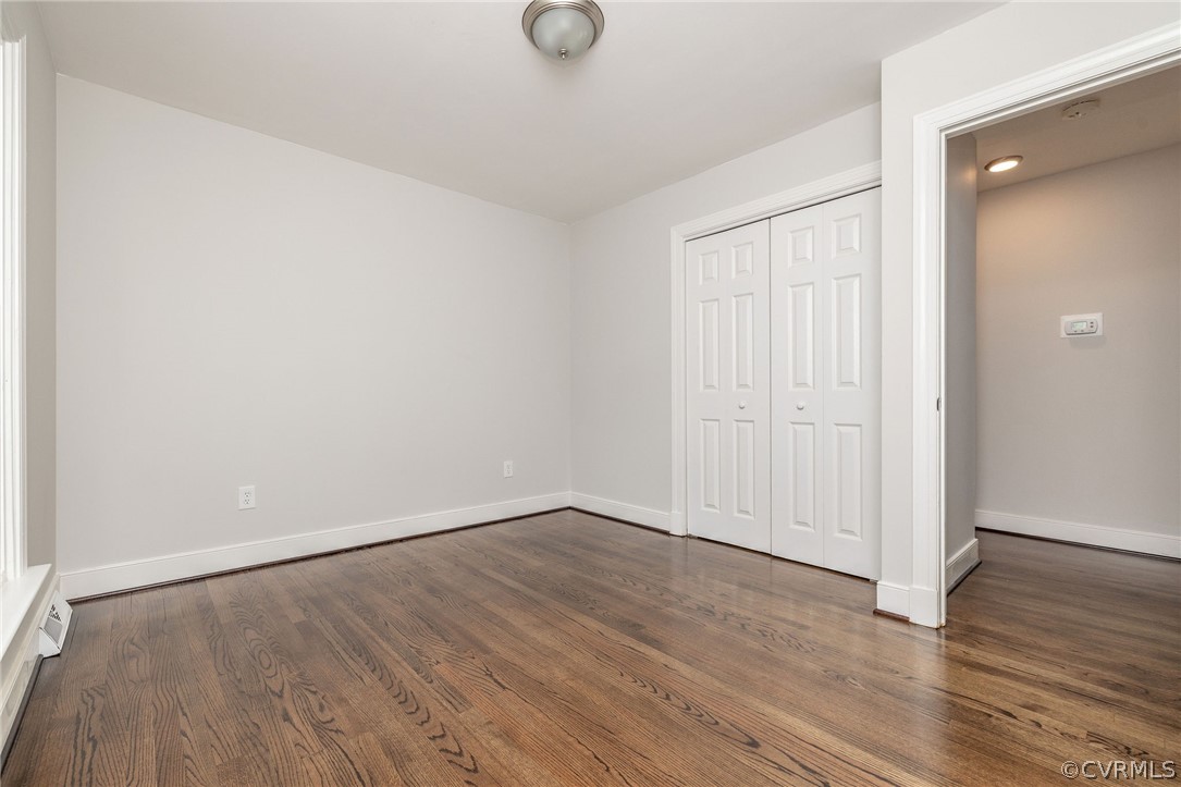 11633 Boyd Road Chester, VA 23831 - Photo 35 of 49 an empty room with wooden floor and windows