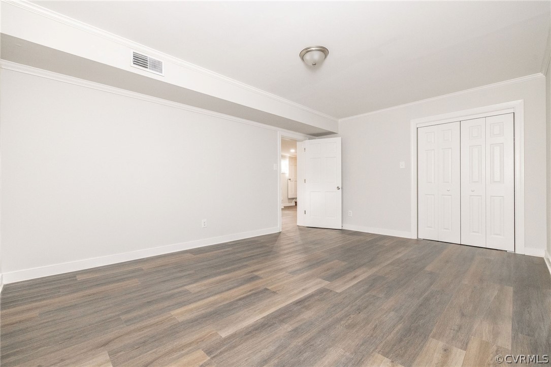 11633 Boyd Road Chester, VA 23831 - Photo 40 of 49 a view of an empty room with wooden floor and a window