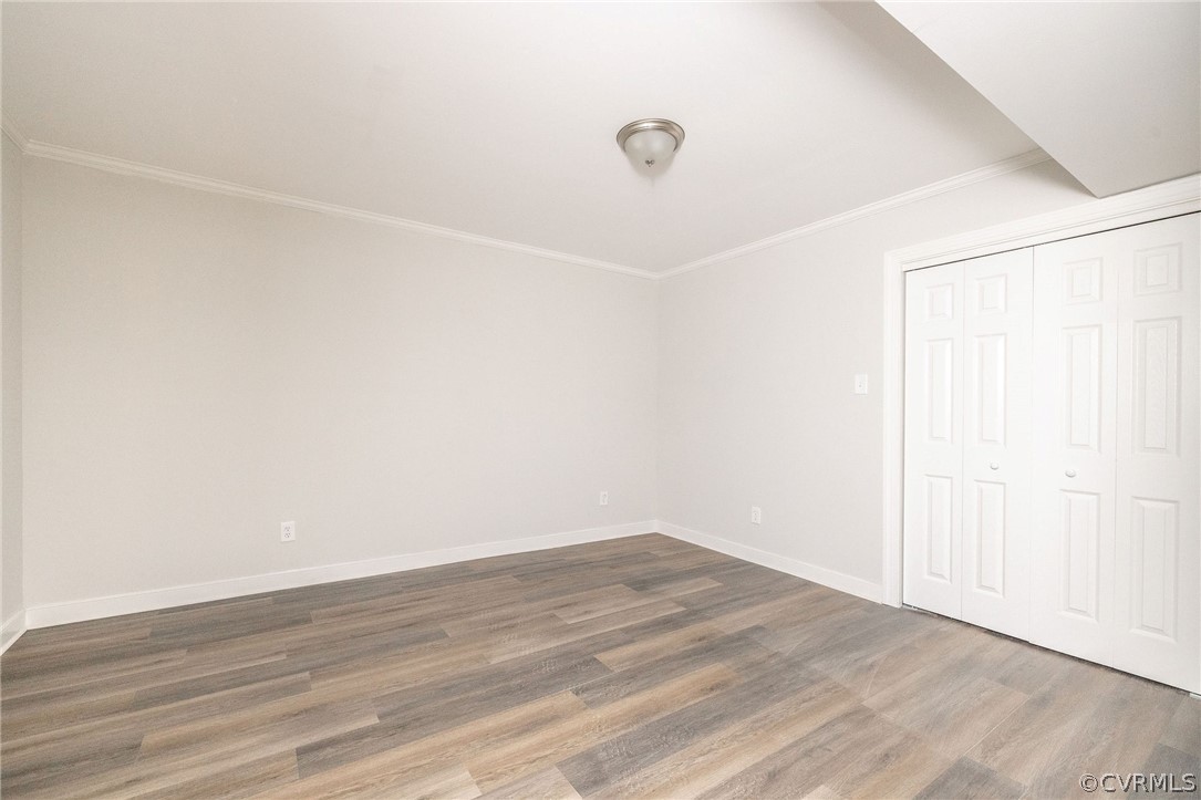11633 Boyd Road Chester, VA 23831 - Photo 41 of 49 an empty room with wooden floor and windows