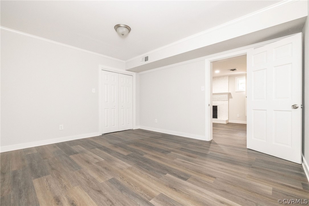 11633 Boyd Road Chester, VA 23831 - Photo 42 of 49 a view of an empty room with wooden floor and a window