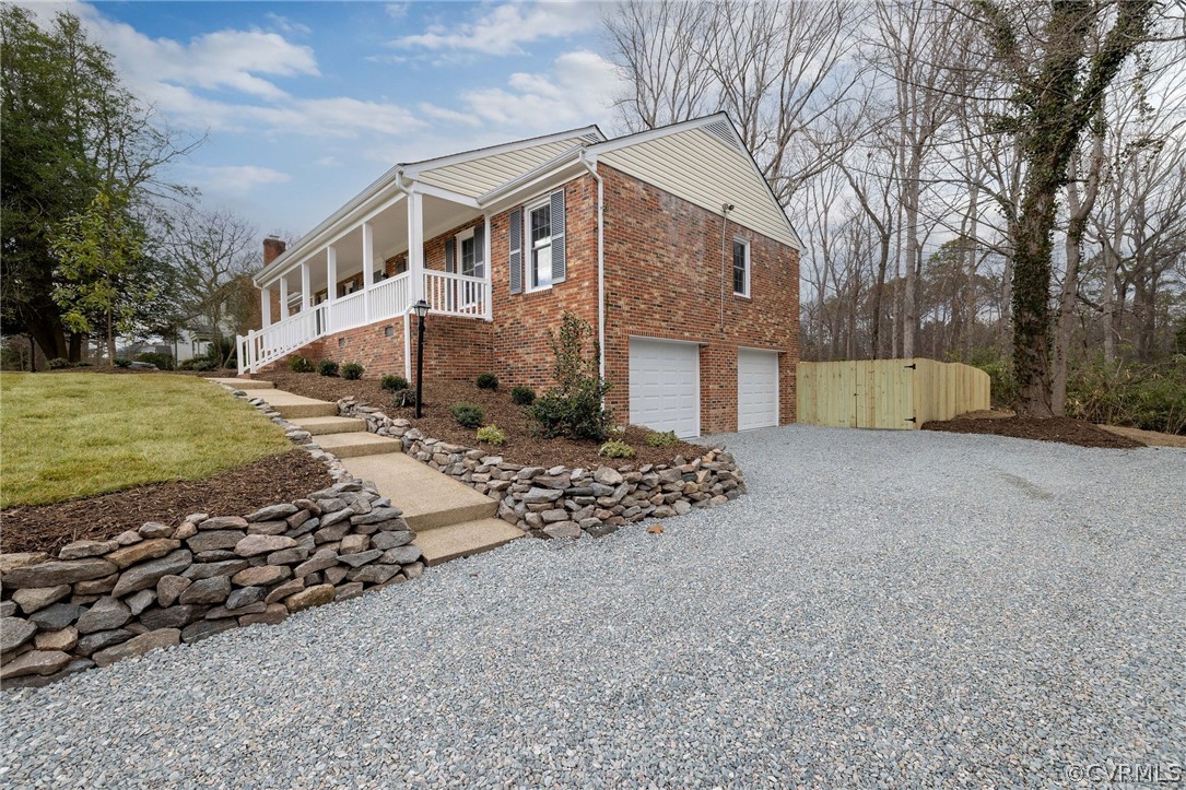 11633 Boyd Road Chester, VA 23831 - Photo 5 of 49 a view of a house with a yard covered in snow