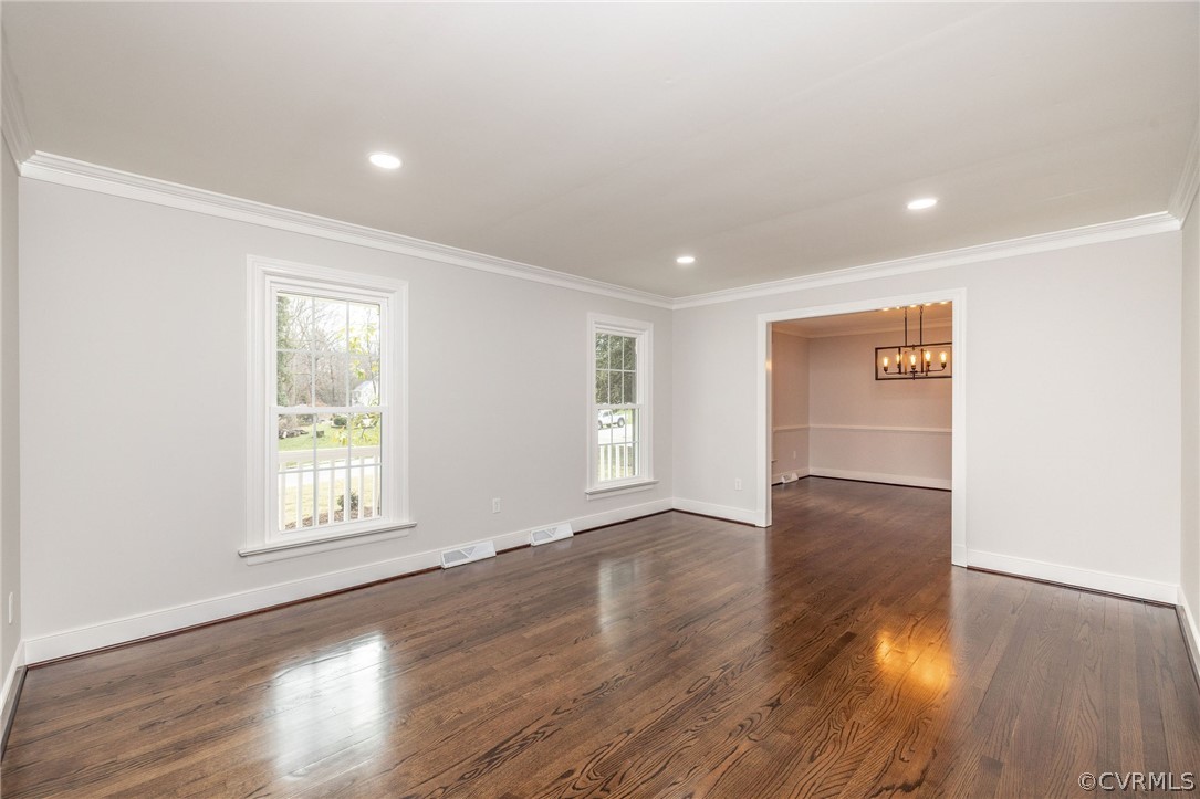 11633 Boyd Road Chester, VA 23831 - Photo 8 of 49 an empty room with wooden floor and windows